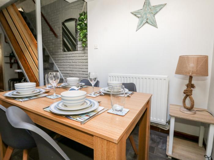 Saddlers Cottage is in Weymouth, Dorset. Two-bedroom home set near amenities and beach. Pet-friendly