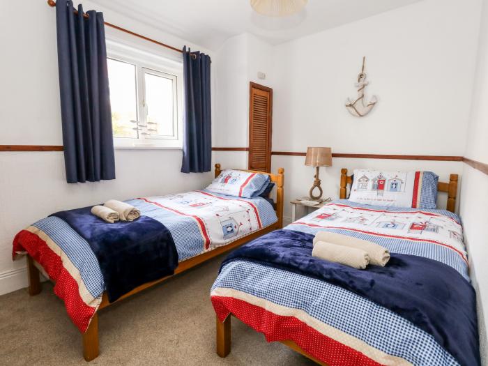 Saddlers Cottage is in Weymouth, Dorset. Two-bedroom home set near amenities and beach. Pet-friendly