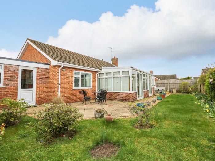 32 Queen Elizabeth Drive, Dersingham, Norfolk. Washer/dryer, off-road parking, enclosed lawn garden.