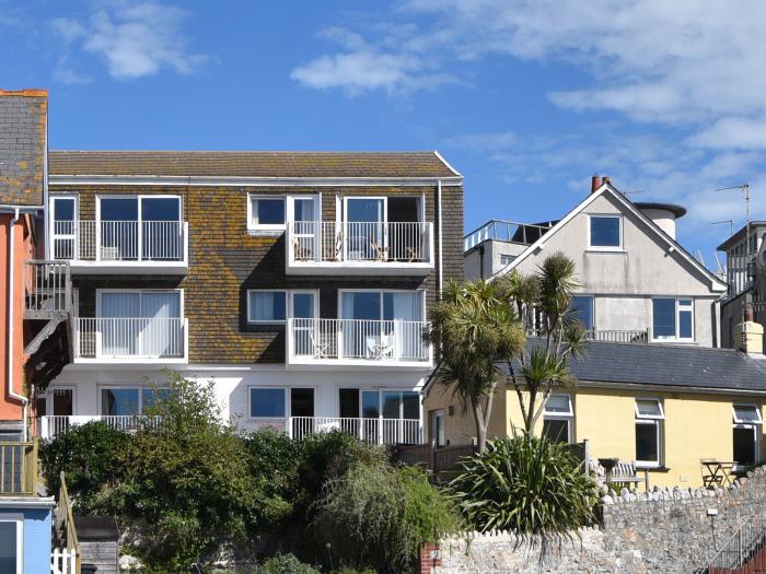 3 Bay View Court in Lyme Regis, Dorset. First-floor apartment. Balcony with furniture. Beach nearby.