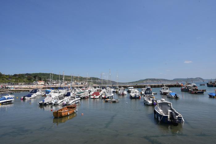 3 Bay View Court in Lyme Regis, Dorset. First-floor apartment. Balcony with furniture. Beach nearby.