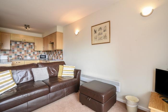 3 Bay View Court in Lyme Regis, Dorset. First-floor apartment. Balcony with furniture. Beach nearby.