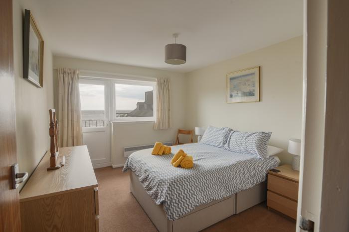 3 Bay View Court in Lyme Regis, Dorset. First-floor apartment. Balcony with furniture. Beach nearby.