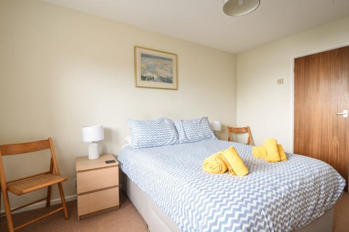 3 Bay View Court in Lyme Regis, Dorset. First-floor apartment. Balcony with furniture. Beach nearby.