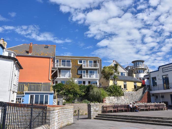 3 Bay View Court in Lyme Regis, Dorset. First-floor apartment. Balcony with furniture. Beach nearby.