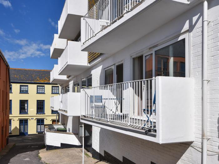 3 Bay View Court in Lyme Regis, Dorset. First-floor apartment. Balcony with furniture. Beach nearby.