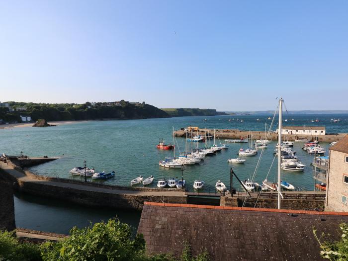 Westwinds in Tenby, Pembrokeshire. Designated parking. Near a shop and pub. Travel cot and highchair