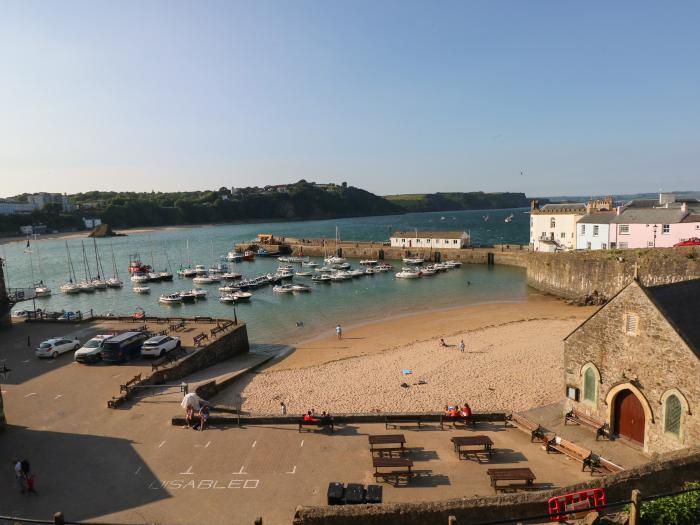 Westwinds in Tenby, Pembrokeshire. Designated parking. Near a shop and pub. Travel cot and highchair