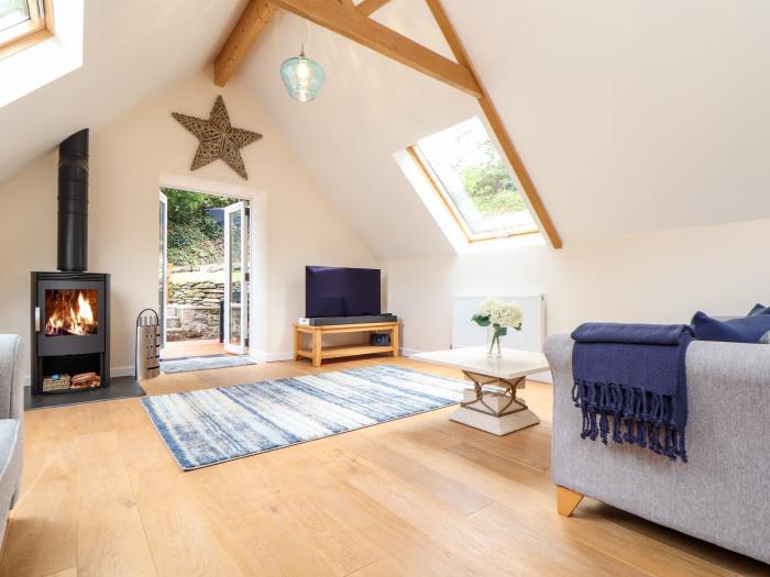 Potters Barn in Helston, Cornwall. Pet-friendly. Stone-built conversion. Reverse level. Two bedrooms