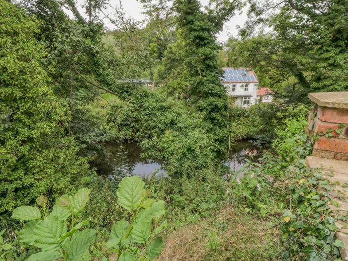 Riverside House in Scarborough, North Yorkshire. Multilevel garden. Games room. Off-road parking.