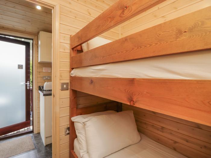 Canadian Cabin 37, is in Keswick, Cumbria. Off-road parking, in a National Park, pet-friendly, 2-bed