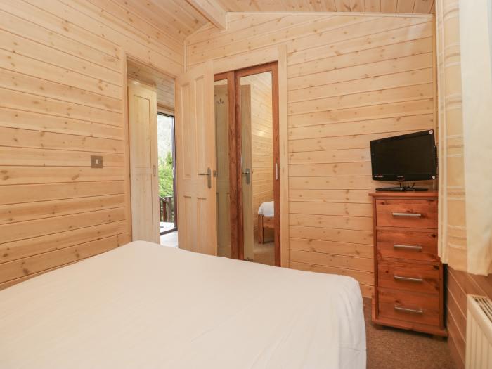 Canadian Cabin 37, is in Keswick, Cumbria. Off-road parking, in a National Park, pet-friendly, 2-bed