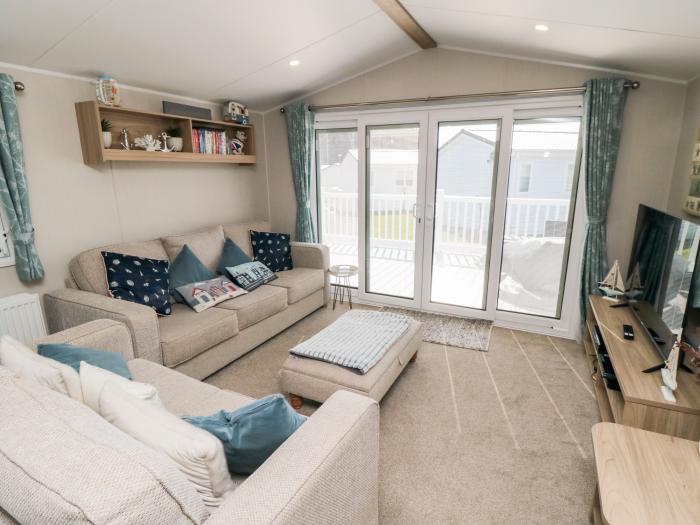 Finch 5 on Cayton Bay Holiday Park, North Yorkshire. 3 bedroom lodge with open-plan living & decking