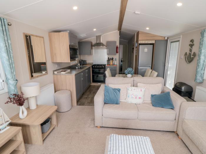 Finch 5 on Cayton Bay Holiday Park, North Yorkshire. 3 bedroom lodge with open-plan living & decking