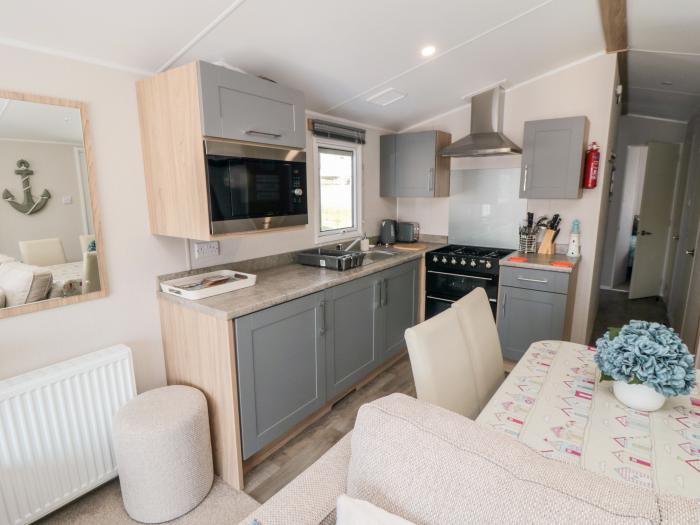 Finch 5 on Cayton Bay Holiday Park, North Yorkshire. 3 bedroom lodge with open-plan living & decking