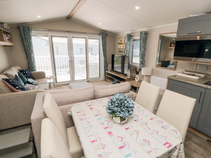 Finch 5 on Cayton Bay Holiday Park, North Yorkshire. 3 bedroom lodge with open-plan living & decking