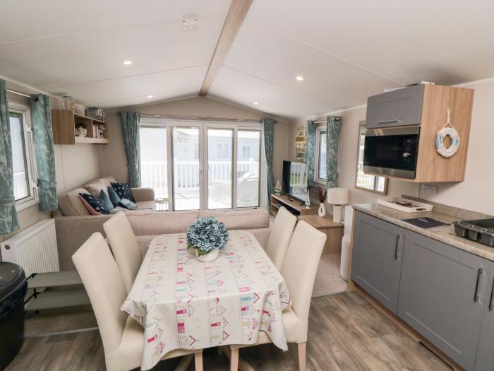 Finch 5 on Cayton Bay Holiday Park, North Yorkshire. 3 bedroom lodge with open-plan living & decking