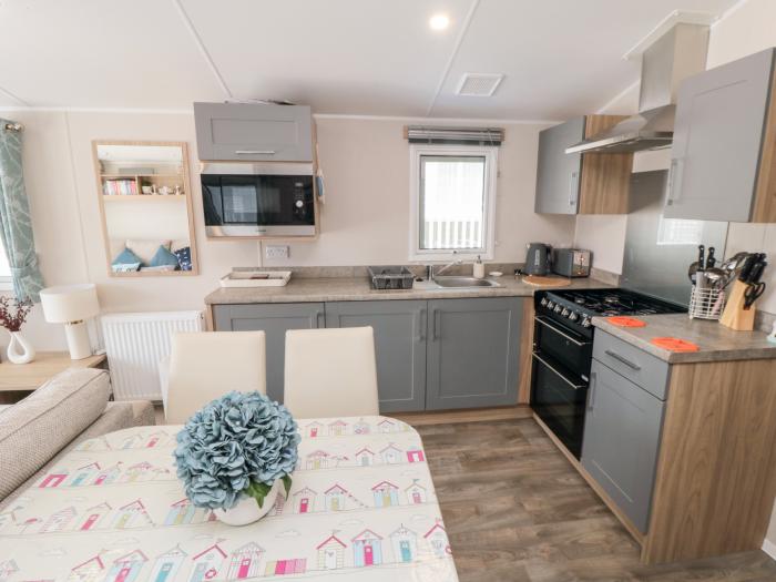 Finch 5 on Cayton Bay Holiday Park, North Yorkshire. 3 bedroom lodge with open-plan living & decking