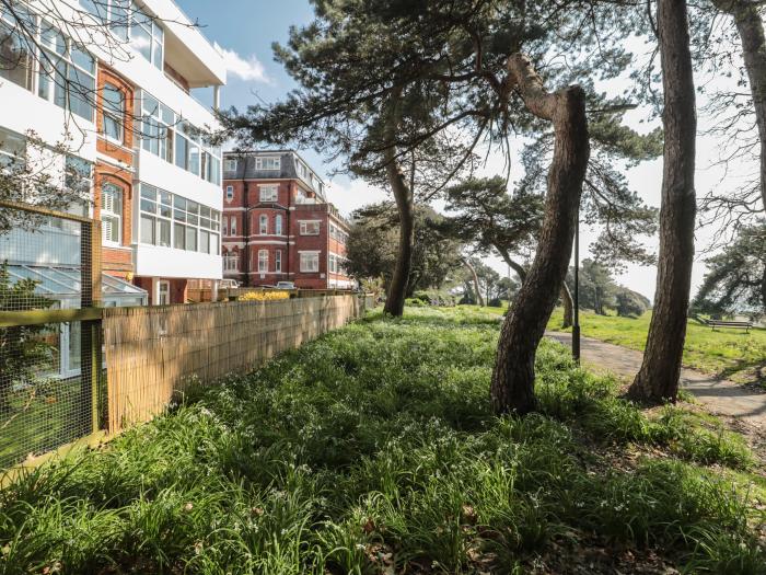 The Pines in Bournemouth in Dorset. First-floor apartment with woodland and sea views. Two bedrooms.