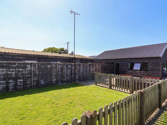 The Old Nursery near Bangor-On-Dee, Wrexham. Wood-cladded home set rurally. Pet and family-friendly.