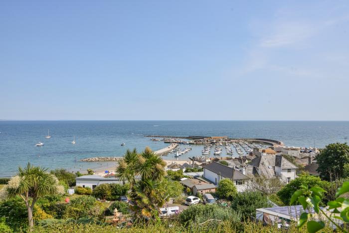 Braeside is in Lyme Regis, in Dorset. Five-bedroom home with sea views, and near beach and amenities