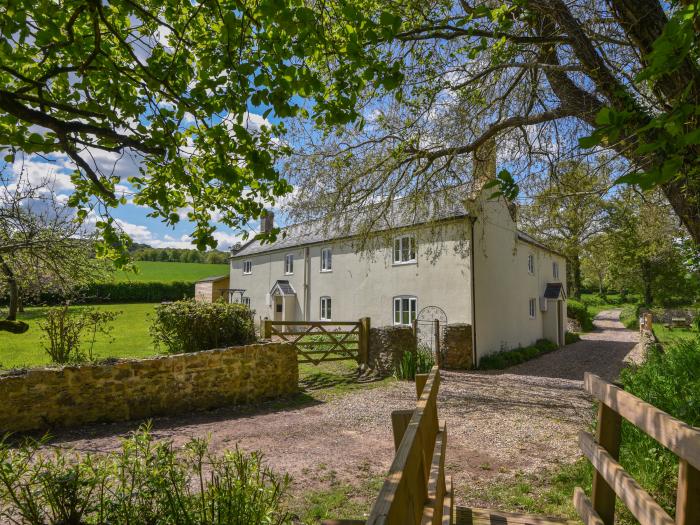 Riverbank, Dalwood, East Devon. Off-road parking. In an AONB. Garden. 2 dogs welcome. Three bedroom.