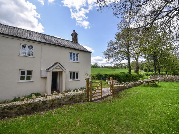 Riverbank, Dalwood, East Devon. Off-road parking. In an AONB. Garden. 2 dogs welcome. Three bedroom.