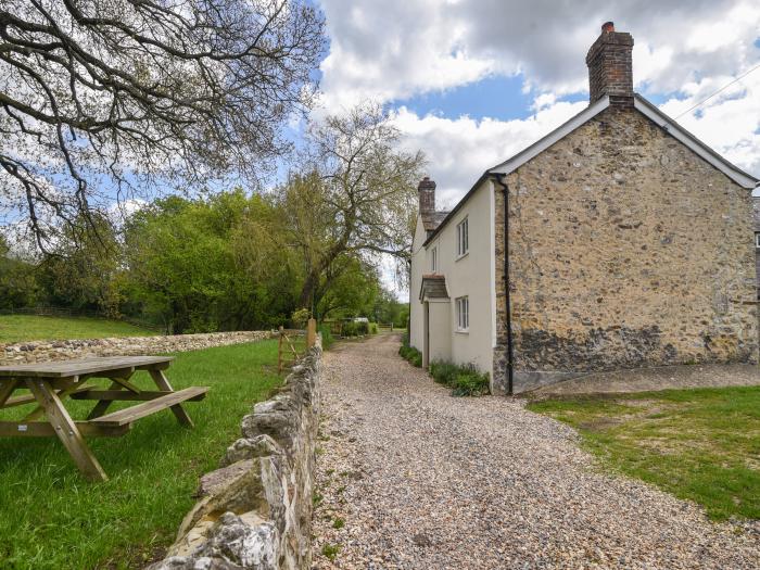 Riverbank, Dalwood, East Devon. Off-road parking. In an AONB. Garden. 2 dogs welcome. Three bedroom.