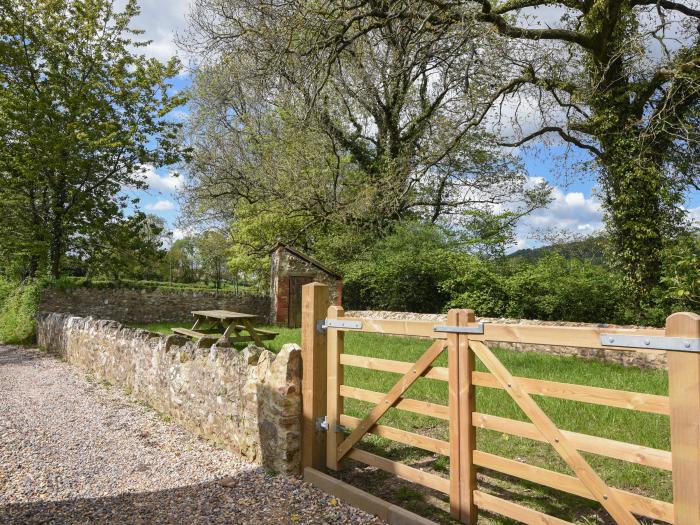 Riverbank, Dalwood, East Devon. Off-road parking. In an AONB. Garden. 2 dogs welcome. Three bedroom.