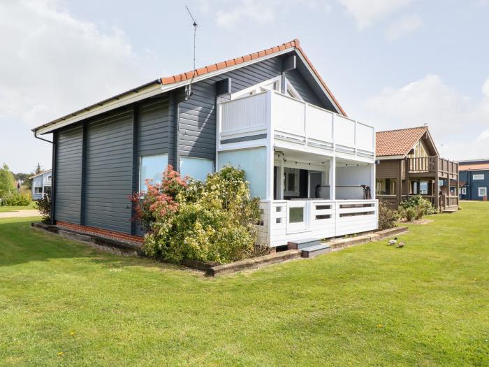 Harmony House near Belton in Norfolk. Two-bedroom, stylish lodge with on-site swimming pool and golf