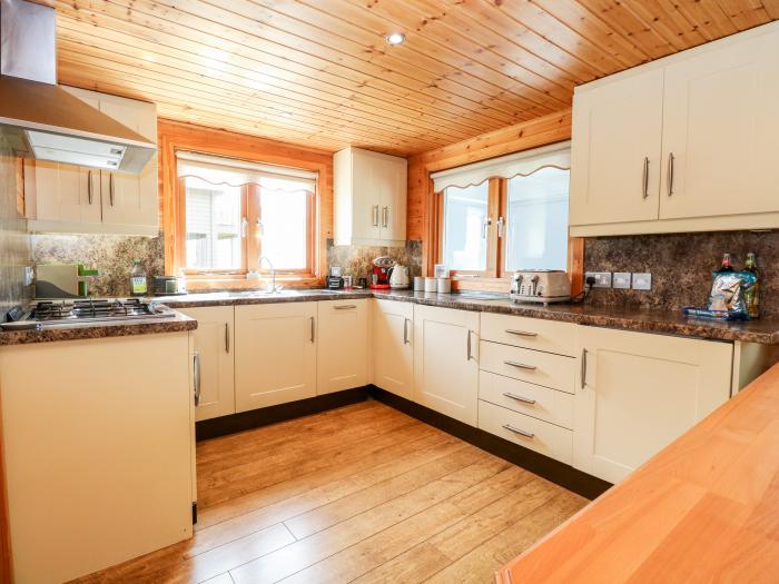 Harmony House near Belton in Norfolk. Two-bedroom, stylish lodge with on-site swimming pool and golf