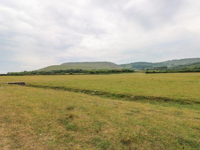 Llety'r Bugail near Glynneath, Rhondda Cynon Taff. Two-bedroom home with EV charger. Near amenities.