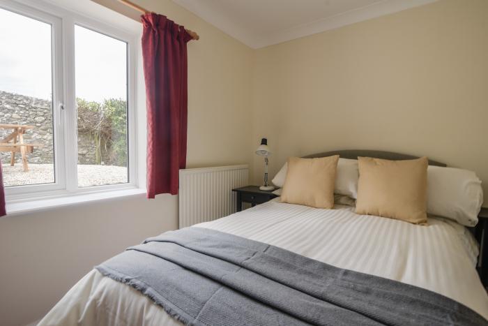 Fawley in Lyme Regis, Dorset. Four bedrooms. Off-road parking. Beach nearby. Electric fire. Smart TV