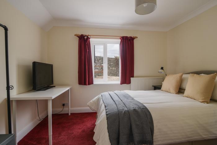 Fawley in Lyme Regis, Dorset. Four bedrooms. Off-road parking. Beach nearby. Electric fire. Smart TV