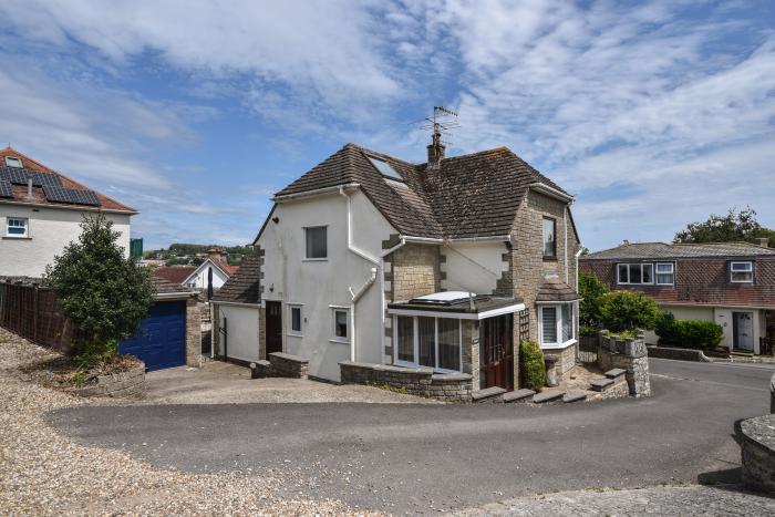 Fawley in Lyme Regis, Dorset. Four bedrooms. Off-road parking. Beach nearby. Electric fire. Smart TV