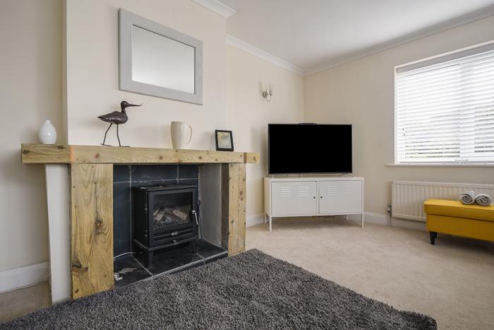 Fawley in Lyme Regis, Dorset. Four bedrooms. Off-road parking. Beach nearby. Electric fire. Smart TV