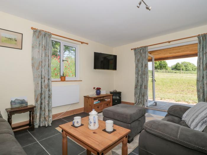 Watermead Lodge in Stogumber, Somerset. Electric fire. Pet-friendly. Two bedrooms. Walking location.