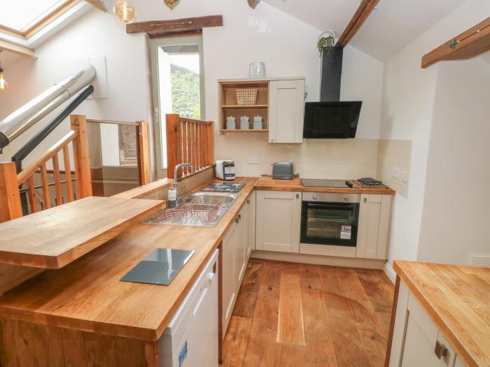 Greenheart Cottage, in Pontrhydyfen, West Glamorgan. Off-road parking. Close to river. Pet-friendly.