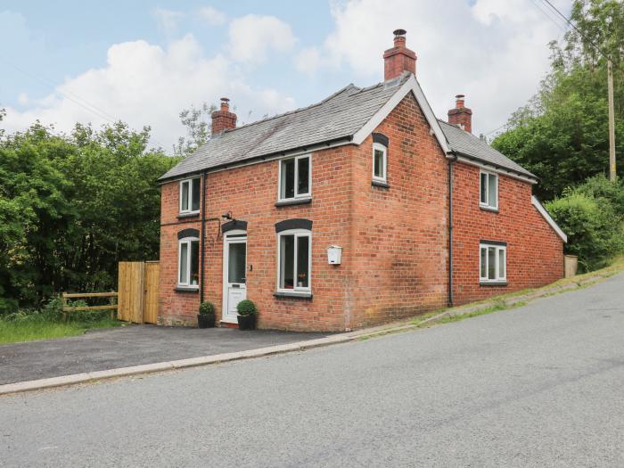 Min Y Nant is near Llangadfan, Powys. Three-bedroom cottage with riverside views. Wood-fired hot tub