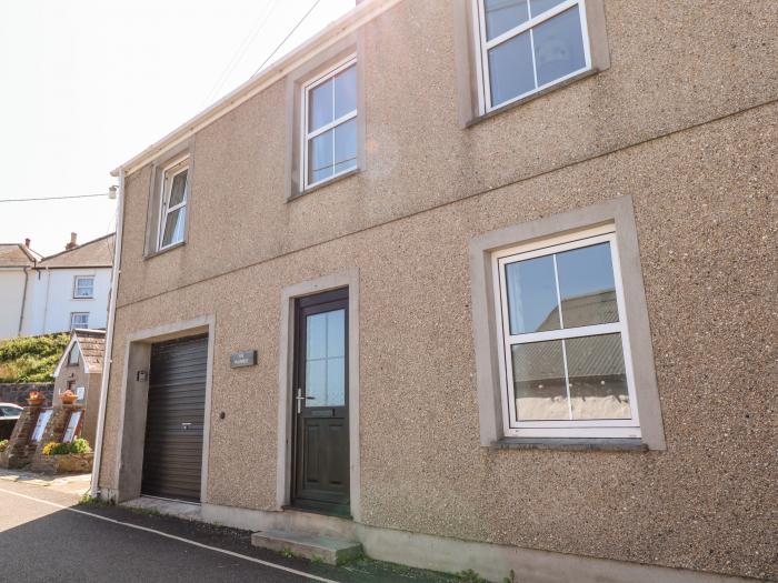 The Mariners in Coverack, Cornwall. Two-bedroom, reverse-level home, enjoying sea views. Near beach.