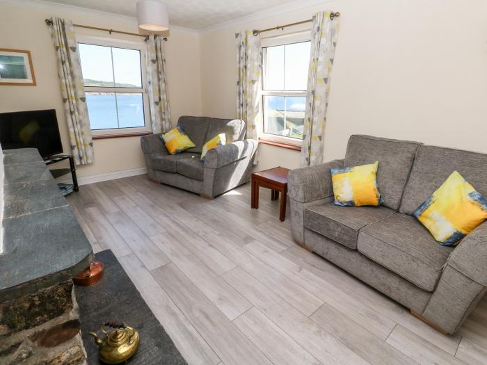 The Mariners in Coverack, Cornwall. Two-bedroom, reverse-level home, enjoying sea views. Near beach.