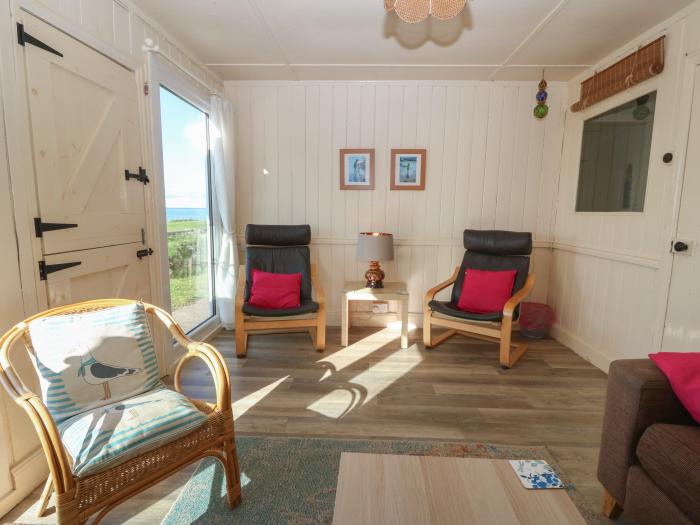 Niwl-y-Mynydd near Clynnog Fawr, Gwynedd. Three-bedroom bungalow with sea views. Near a beach. Pets.