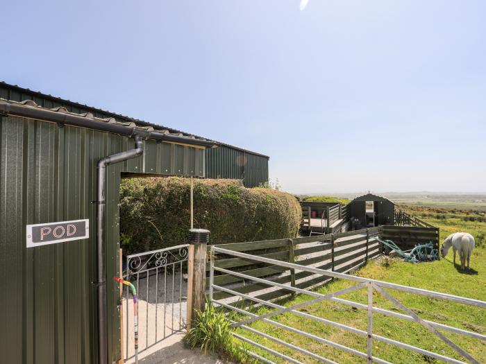 Glamping Pod, Llithfaen, Gwynedd. Ideal for couples. Rural and secluded setting. Decking with seats.