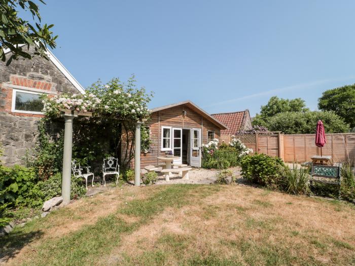 Little Wick is in Lympsham, Somerset. Two-bedroom stable conversion. Enclosed, pretty garden. Family