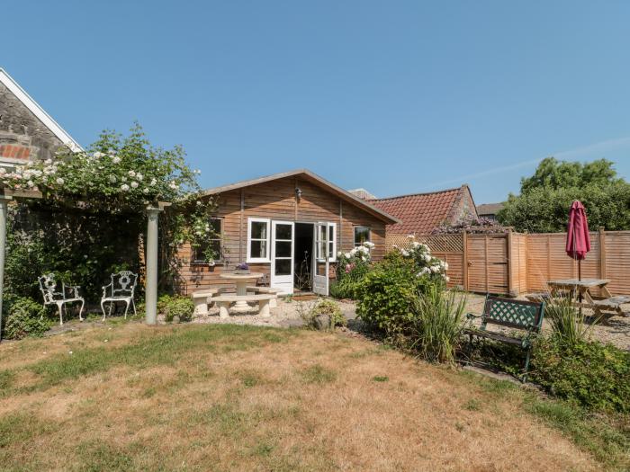 Little Wick is in Lympsham, Somerset. Two-bedroom stable conversion. Enclosed, pretty garden. Family