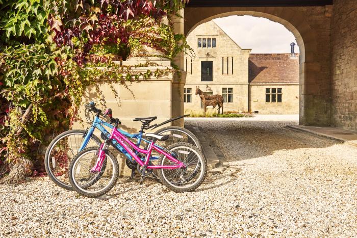 The Smithy is in Humshaugh, Northumberland. Three-bedroom home with woodburning stove. Contemporary.