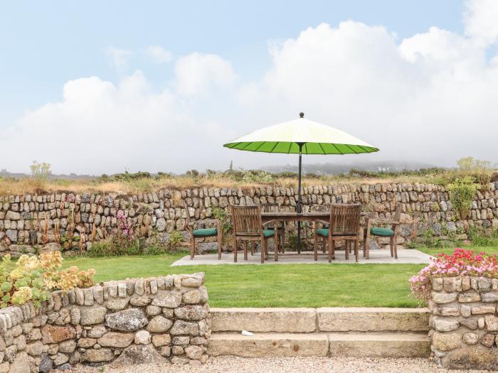 The Riblows nr St Just, Cornwall. Three-bedroom farmhouse with sea views. Hot tub and pretty garden.