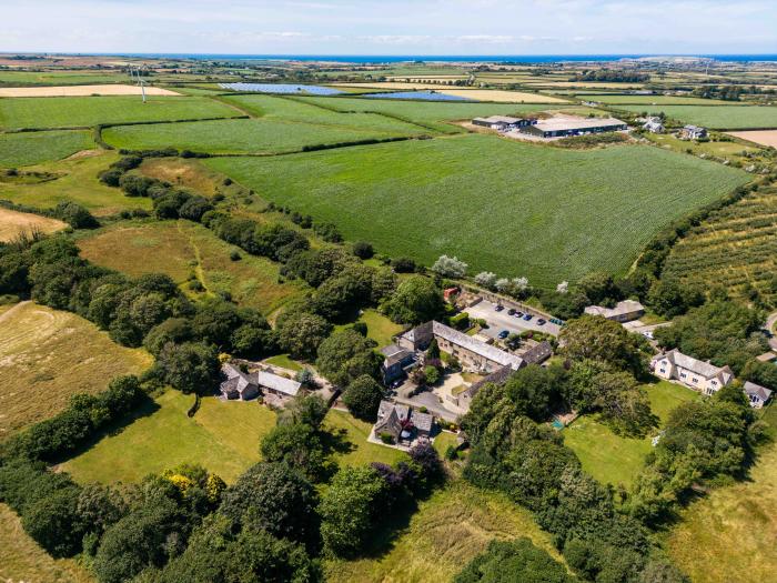 The Coach House is near Padstow, in Cornwall. Four-bedroom, stylish home with expansive garden. Pets