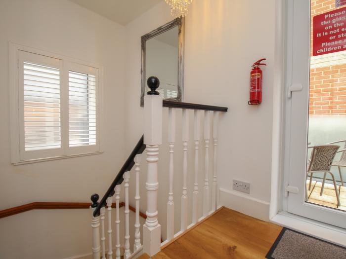 The Cottage, in Weymouth, Dorset. Close to amenities. Close to a beach. Smart TV. Enclosed balcony.