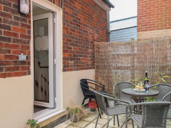 The Cottage, in Weymouth, Dorset. Close to amenities. Close to a beach. Smart TV. Enclosed balcony.